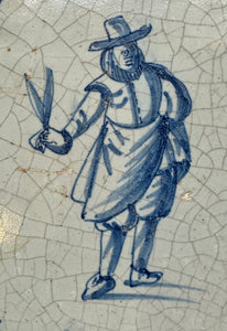 T57)17th century delft tile with man with succors