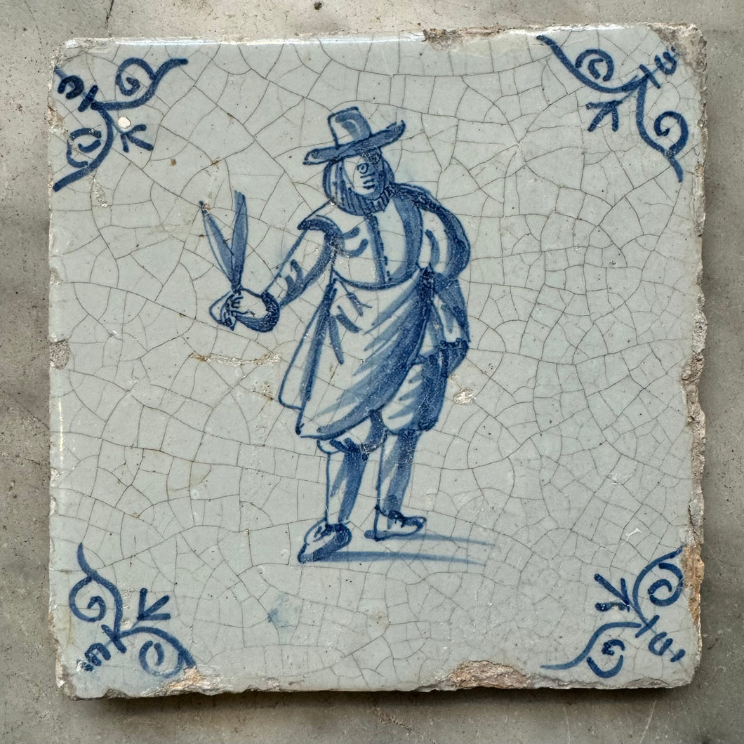 T57)17th century delft tile with man with succors