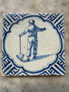 T38) 17 th century tile with farmer