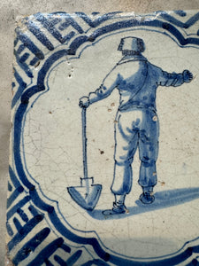 T38) 17 th century tile with farmer