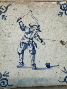 T11) 17th century delft tile , child playing with a top