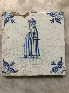 17th century delft tile handpainted with woman
