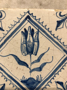 17 th century delft tile with tulip