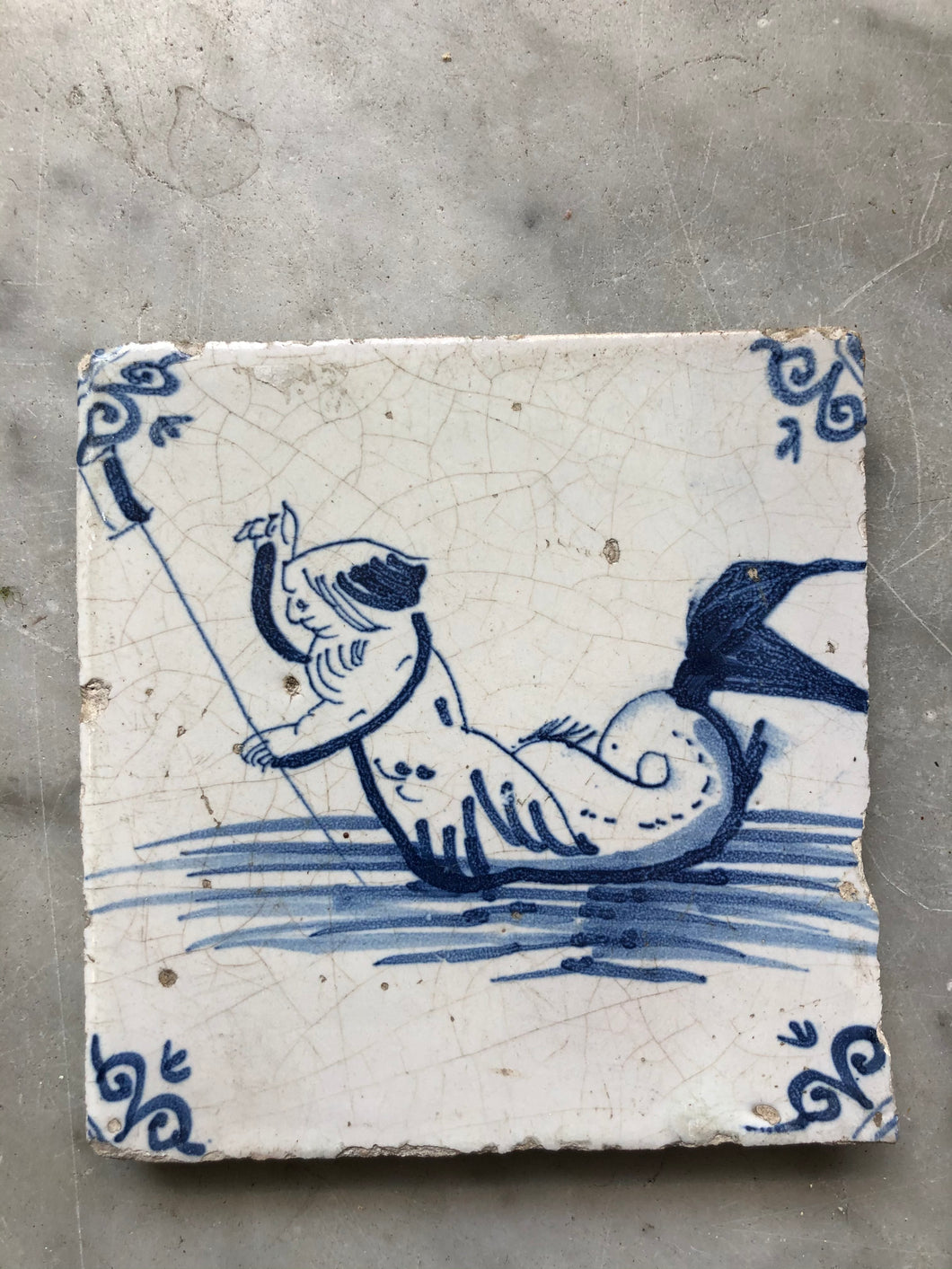 17 th century delft tile with mairman