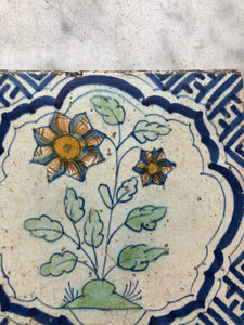 17 th century delft handpainted dutch tile with flower
