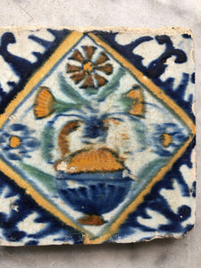 Very small 17 th century delft tile with flowervase