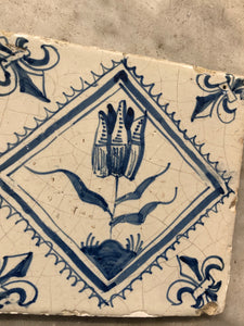 17 th century delft tile with tulip