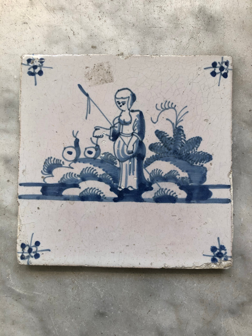 18th century Delft handpainted tile with shepard lady.