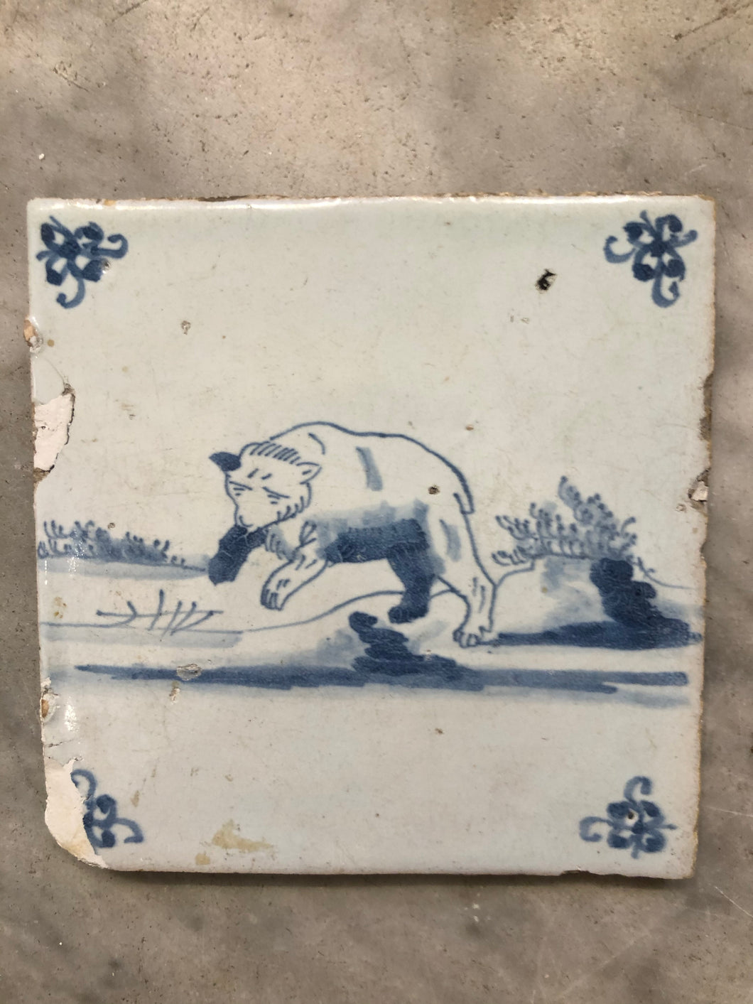 17th century delft tile with bear