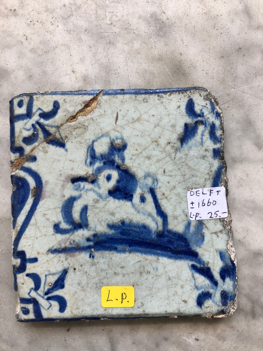 17 th century delft tile with dog