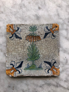 17 th century delft tile with flower