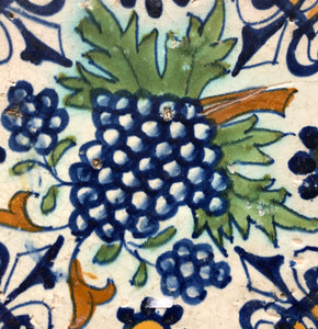 Early polychrome dutch delft tile with grapes
