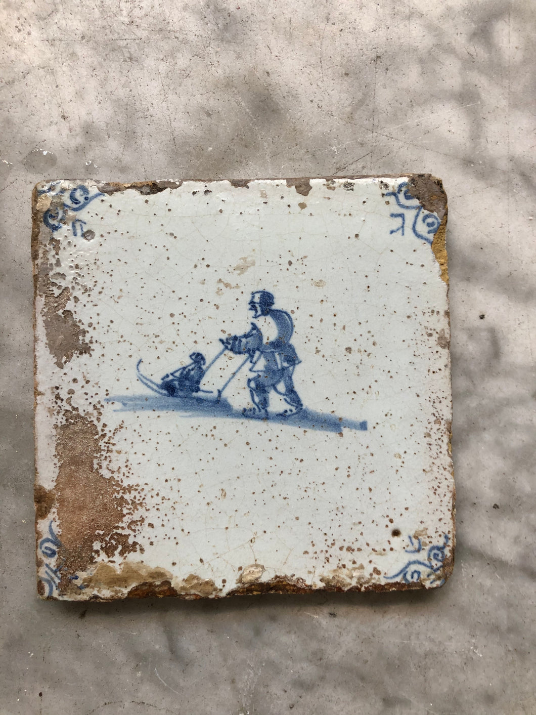 17 th century delft tile with skaters