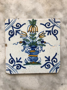 Nice early polychrome delft tile with flower vase