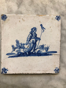 18 th century delft tile with shepherd lady